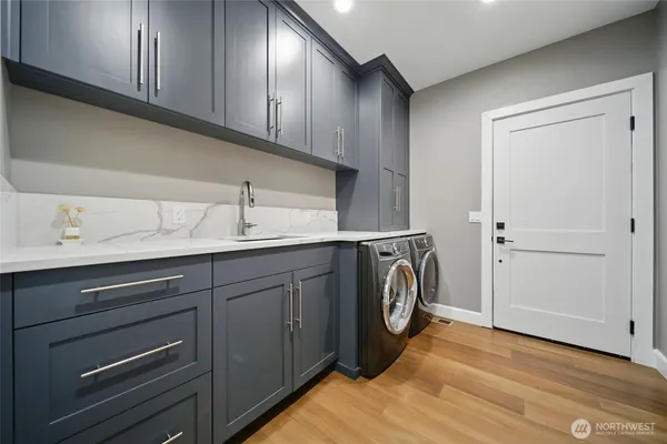 a utility room with cabinets