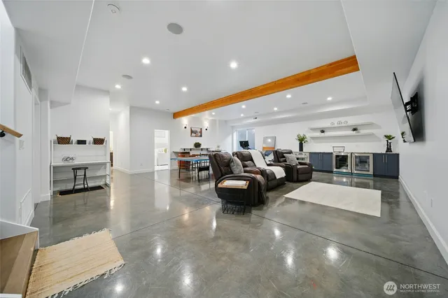 a living room with lots of furniture and a flat screen tv