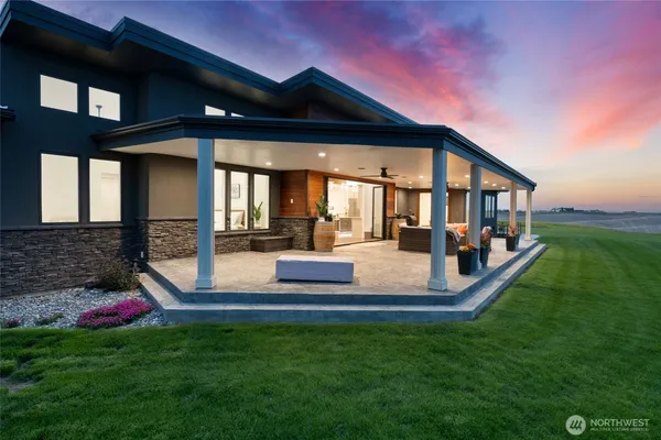 a view of an house with backyard porch and sitting area