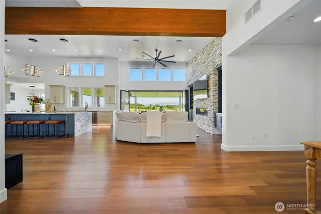 a living room with furniture and kitchen view