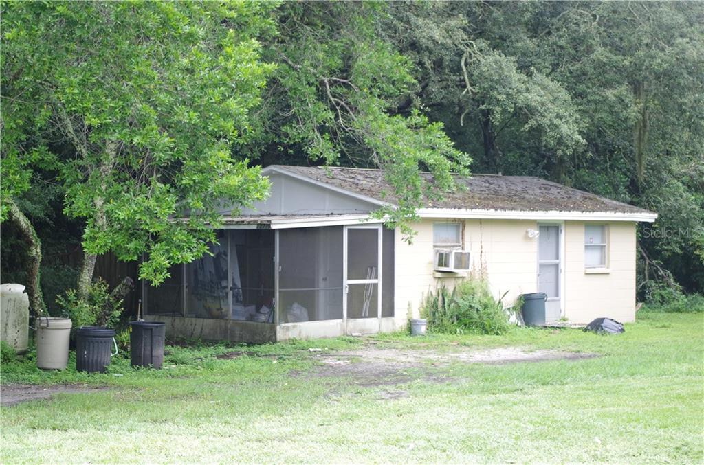 12710 North 53rd Street Temple Terrace, FL 33617 - Photo 1 of 1 a view of a house with yard and a garden