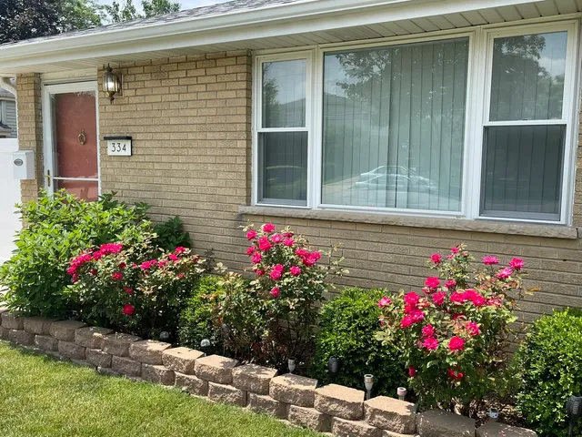 a view of a flowers in front of a house