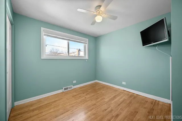 a view of a room with a flat screen tv