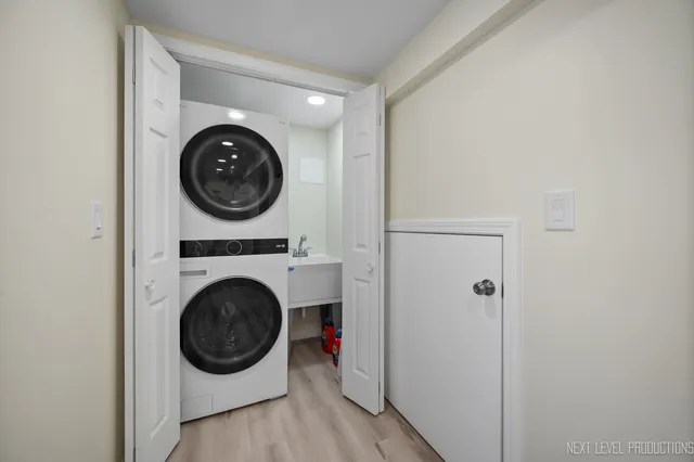a view of a hallway with washer and dryer