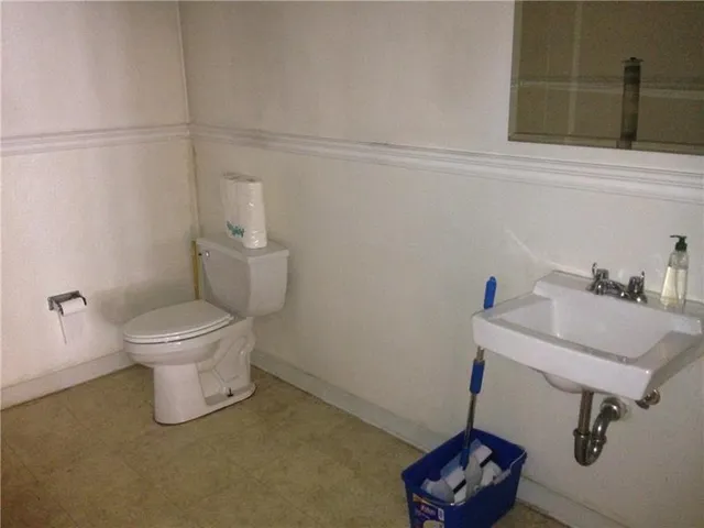 a bathroom with a toilet and a sink