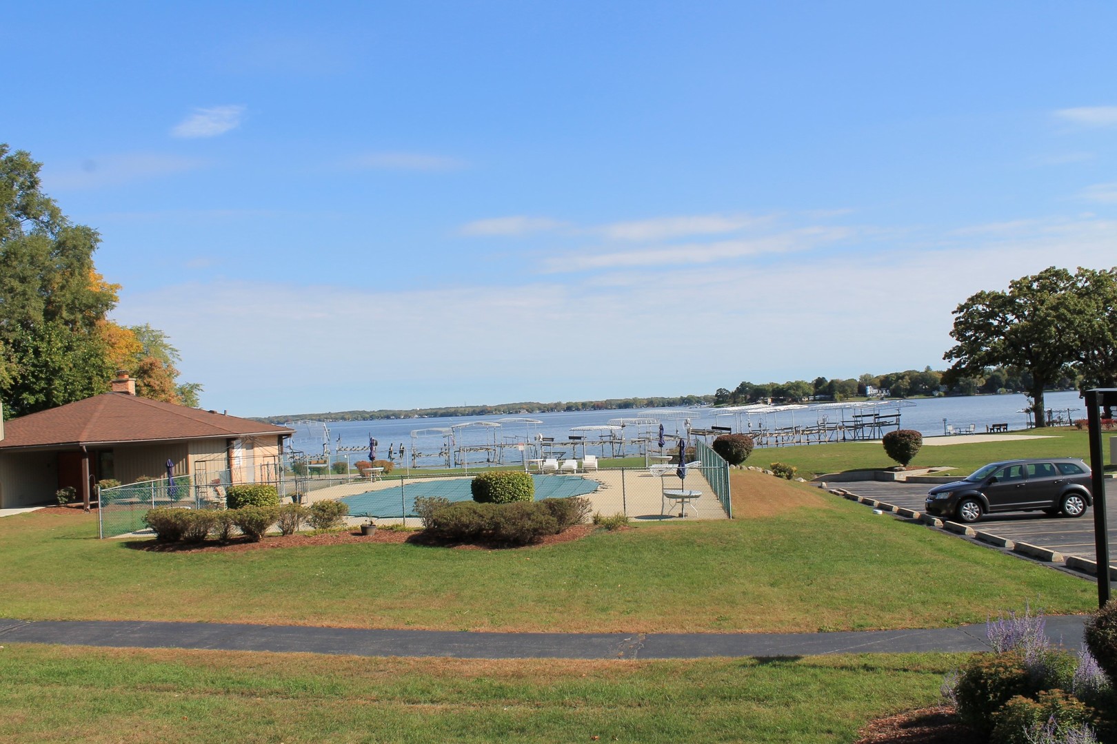 69 White Oaks Road, Unit 69 Fox Lake, IL 60020 - Photo 13 of 16 a view of a lake with houses in the back