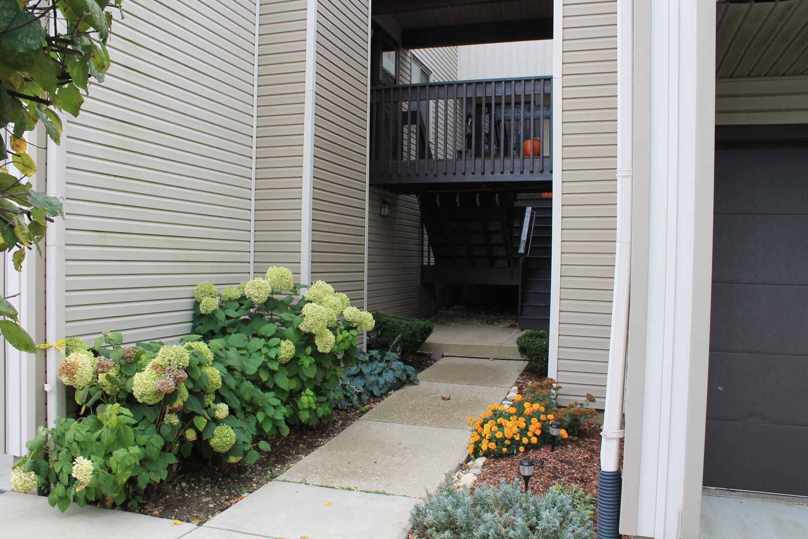 69 White Oaks Road, Unit 69 Fox Lake, IL 60020 - Photo 2 of 16 a front view of a house with outdoor seating