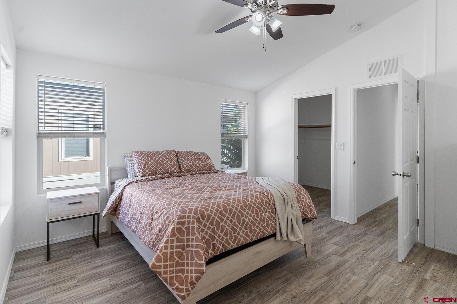 901 6530 Road, Unit 2836 Montrose, CO 81401 - Photo 11 of 21 a bedroom with a bed and a chandelier