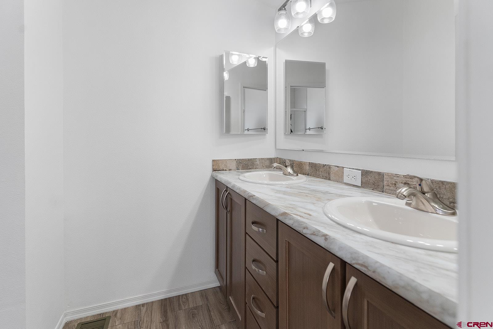 901 6530 Road, Unit 2836 Montrose, CO 81401 - Photo 12 of 21 a bathroom with a granite countertop sink and a mirror