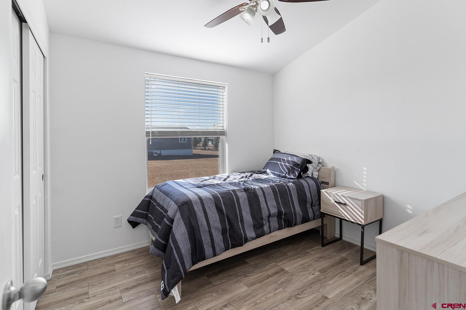 901 6530 Road, Unit 2836 Montrose, CO 81401 - Photo 14 of 21 a bedroom with a bed and window