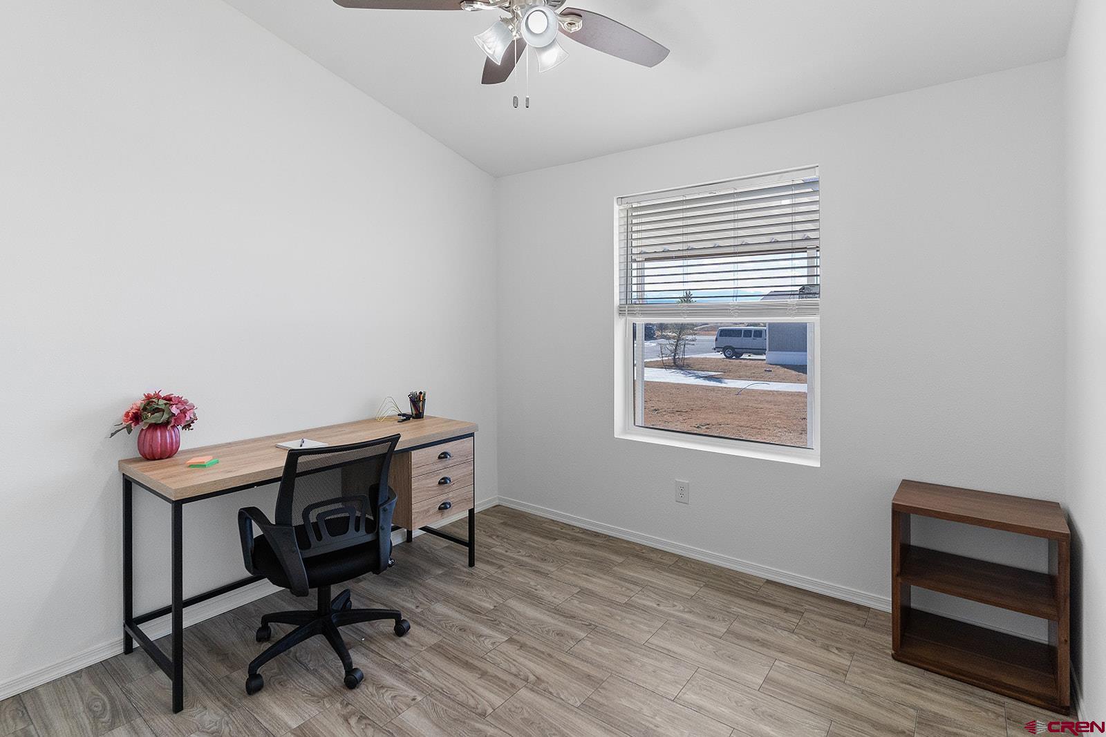 901 6530 Road, Unit 2836 Montrose, CO 81401 - Photo 16 of 21 a view of a workspace with furniture and a window