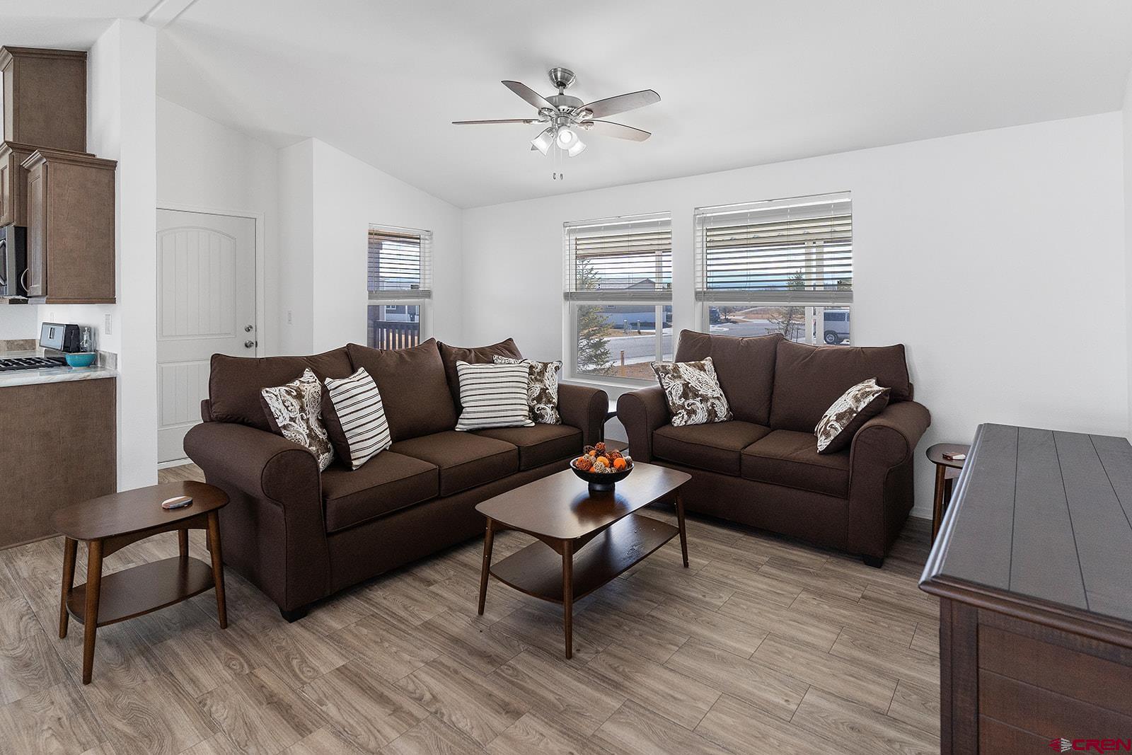 901 6530 Road, Unit 2836 Montrose, CO 81401 - Photo 4 of 21 a living room with furniture and a ceiling fan