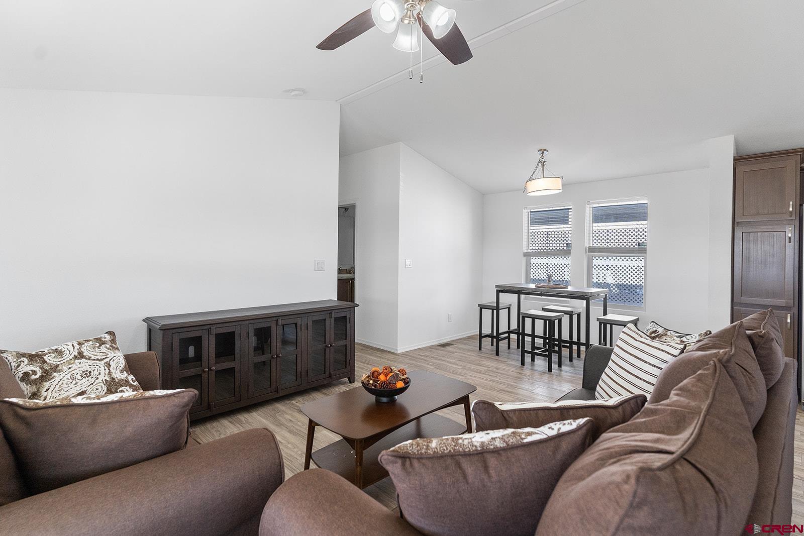 901 6530 Road, Unit 2836 Montrose, CO 81401 - Photo 5 of 21 a living room with furniture and a table