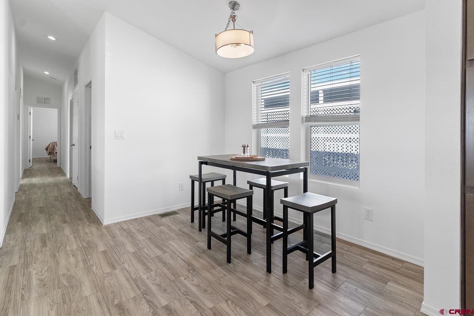 901 6530 Road, Unit 2836 Montrose, CO 81401 - Photo 8 of 21 a view of a dining room with furniture window and wooden floor