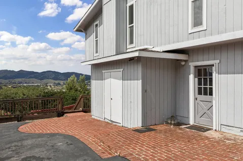 a backyard of a house with lake view and city view