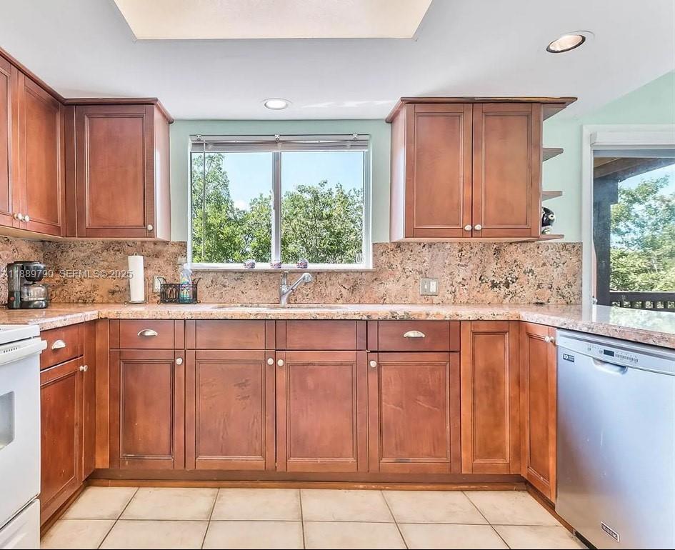 202 West Canal Drive Key Largo, FL 33037 - Photo 1 of 29 a kitchen with cabinets appliances and a window