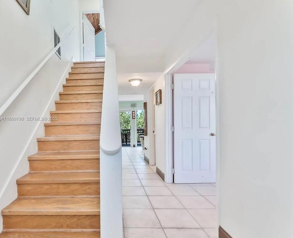 202 West Canal Drive Key Largo, FL 33037 - Photo 11 of 29 a view of an entryway with staircase