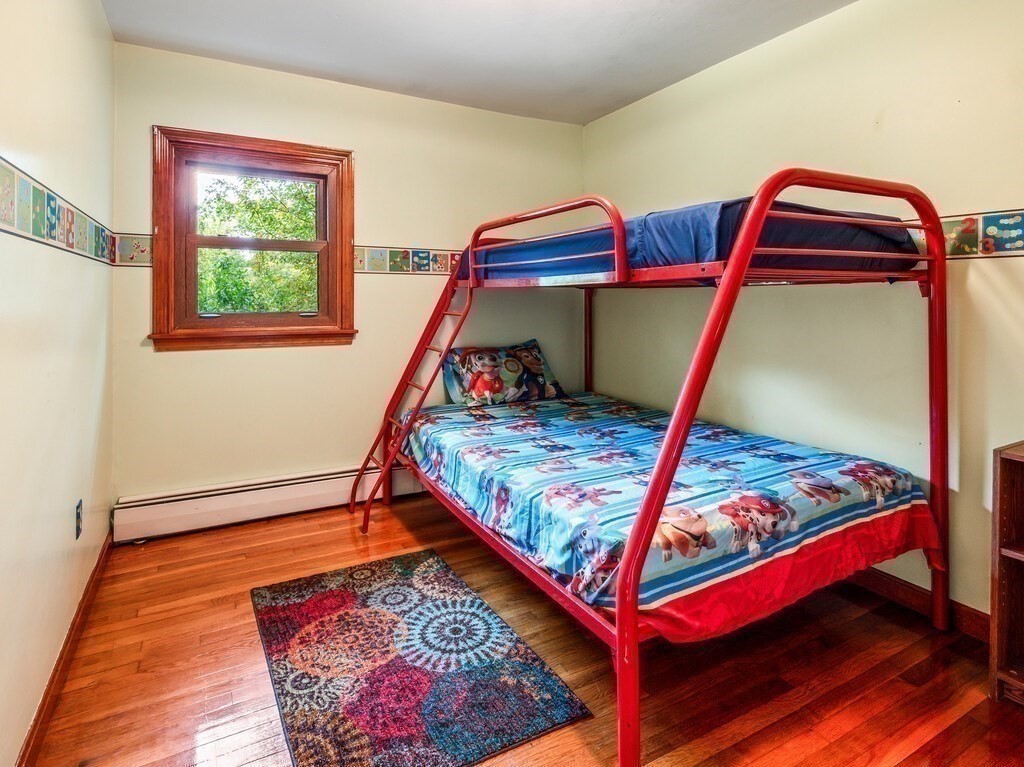 30 Russell Hill Road Ashburnham, MA 01430 - Photo 27 of 41 a bed sitting in a bedroom next to a window