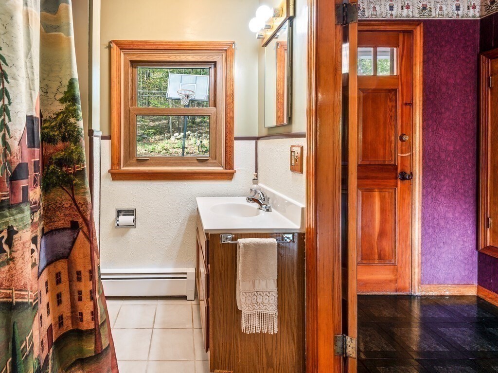 30 Russell Hill Road Ashburnham, MA 01430 - Photo 30 of 41 a bathroom with a sink a mirror and a window