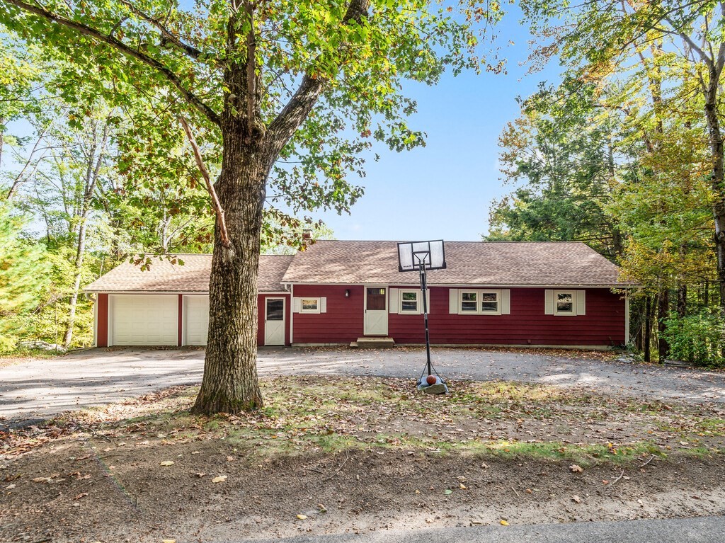 30 Russell Hill Road Ashburnham, MA 01430 - Photo 3 of 41 a view of a house with a large tree and a big yard