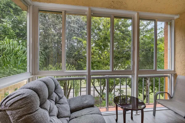 a living room with furniture and a window
