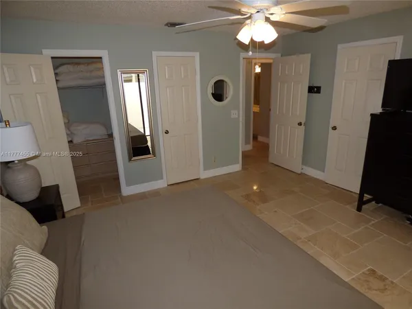 a view of livingroom with hardwood floor and a ceiling fan