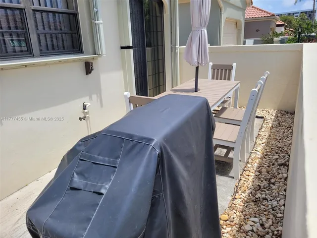 a view of balcony with furniture