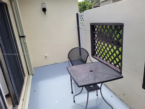 a view of room with window and wooden floor