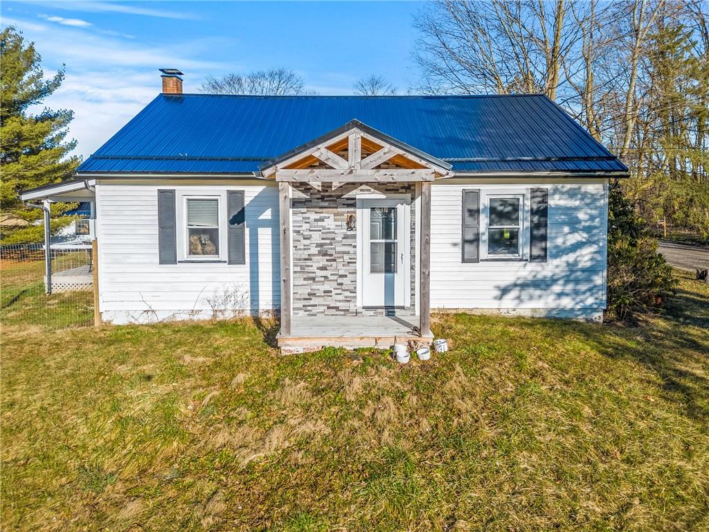 259 Line Road Mercer, PA 16137 - Photo 1 of 33 a view of a house with a yard and potted plants