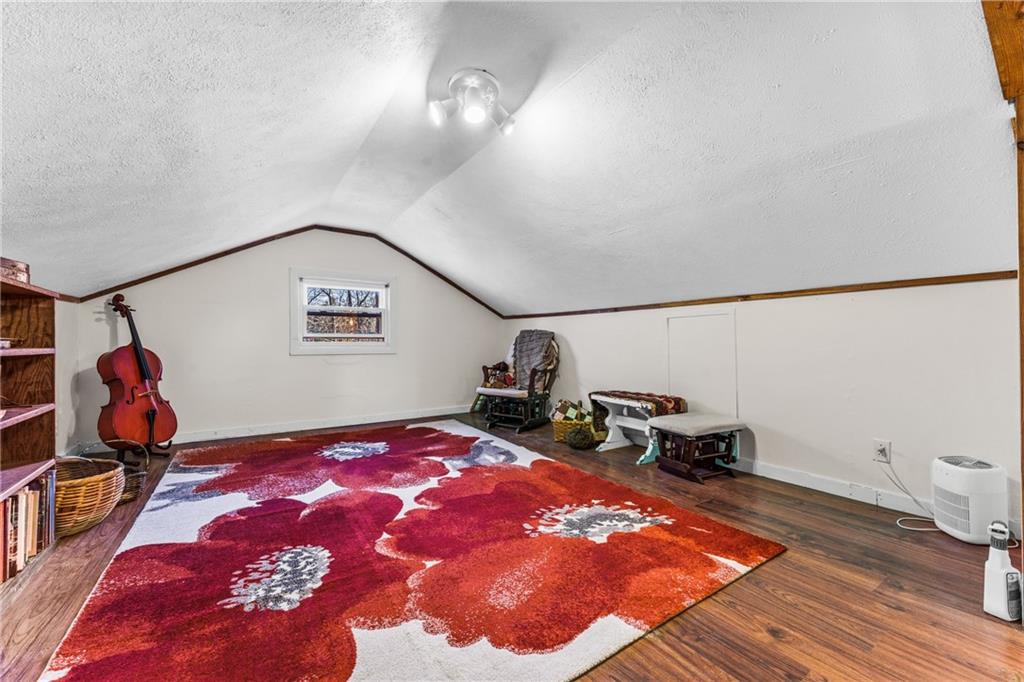 259 Line Road Mercer, PA 16137 - Photo 24 of 33 a bedroom with a bed and a chandelier