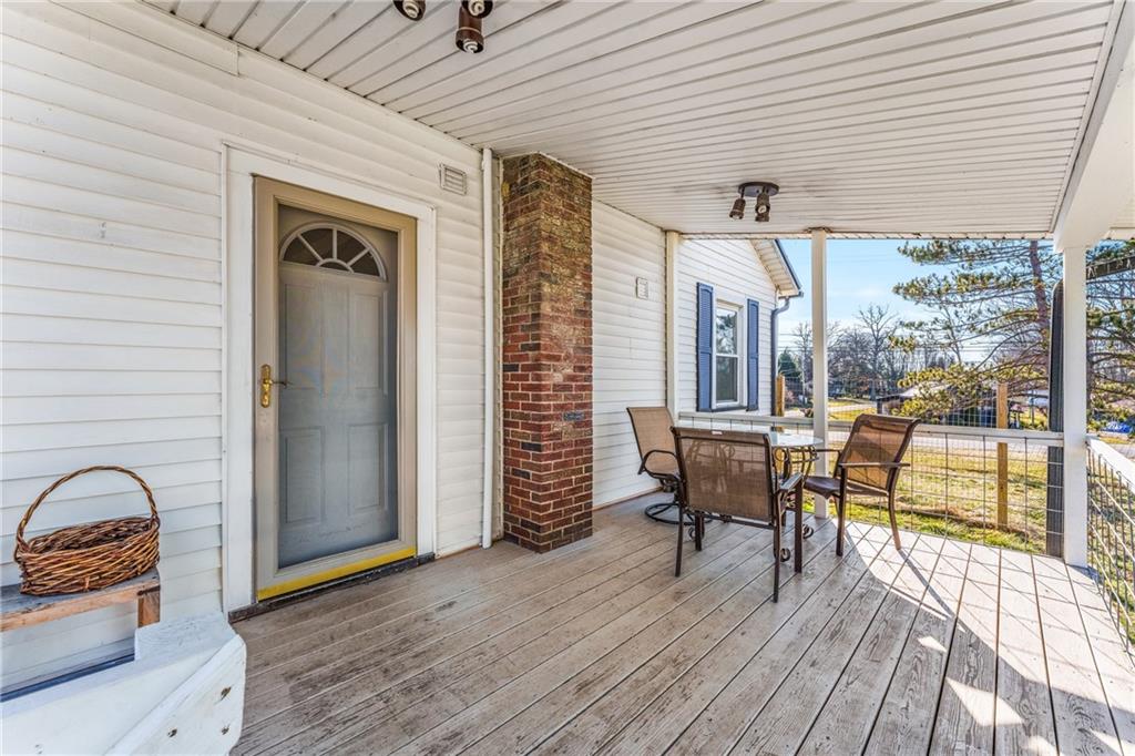 259 Line Road Mercer, PA 16137 - Photo 26 of 33 a view of a patio with table and chairs and wooden floor