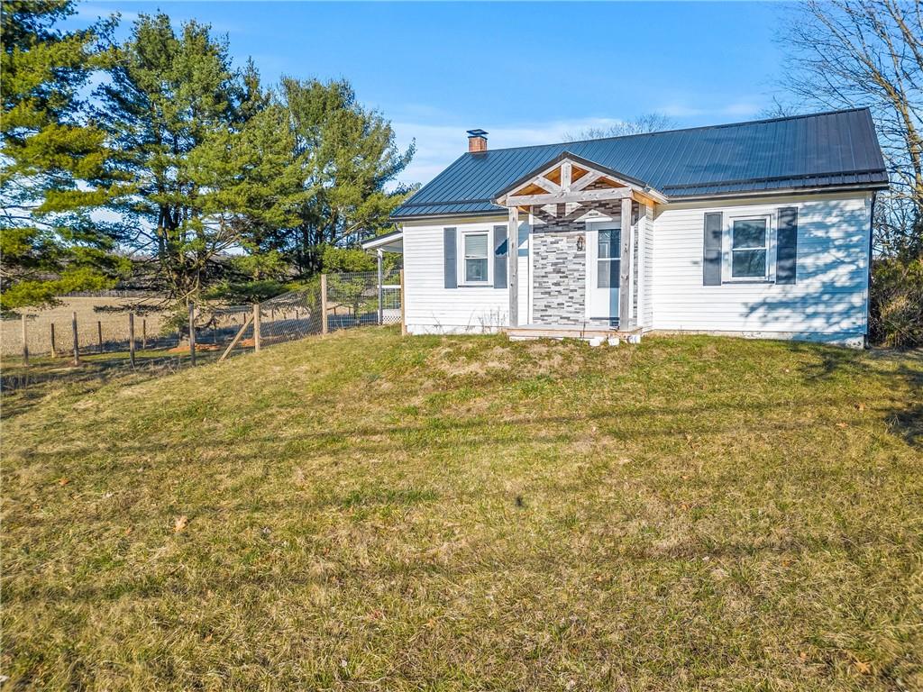259 Line Road Mercer, PA 16137 - Photo 8 of 33 a front view of a house with a garden