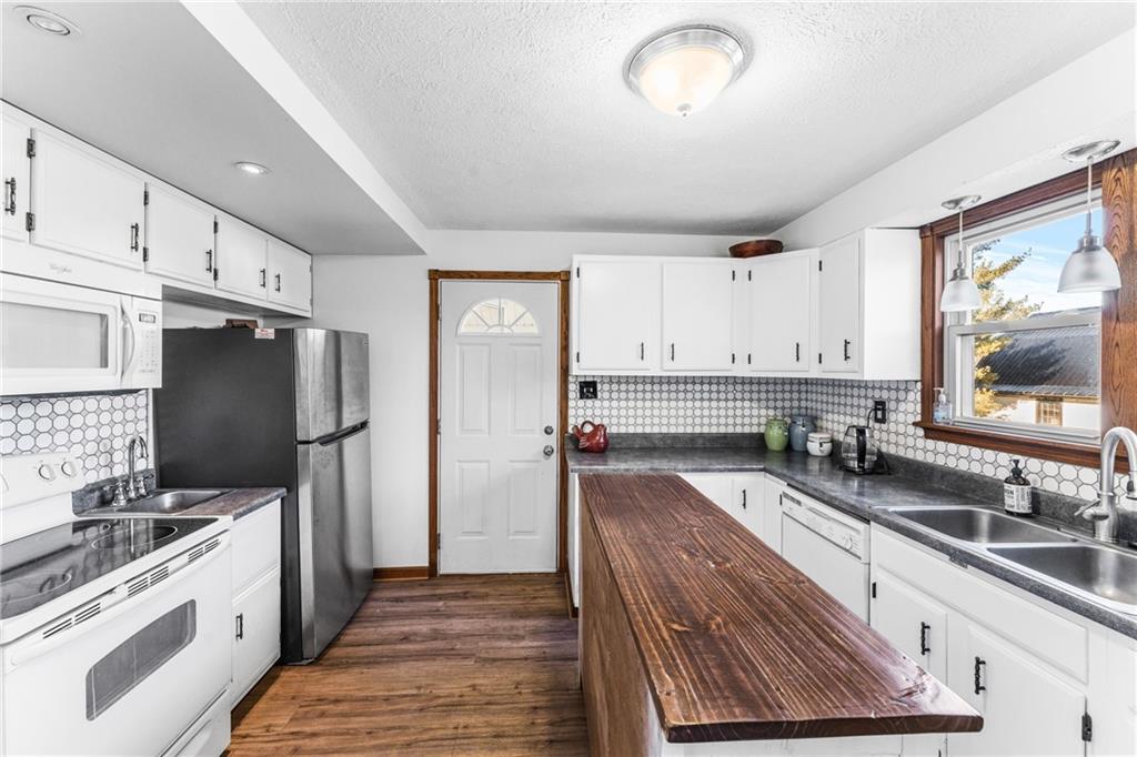 259 Line Road Mercer, PA 16137 - Photo 10 of 33 a kitchen with granite countertop a refrigerator stove and sink