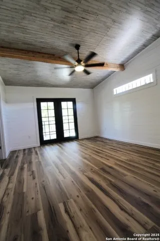 a view of front door with wooden floor