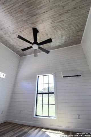 a view of wooden floor with entryway