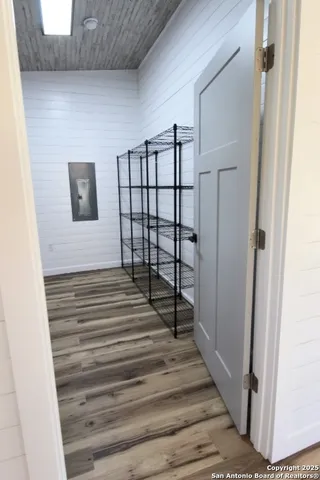 a view of a room with wooden walls