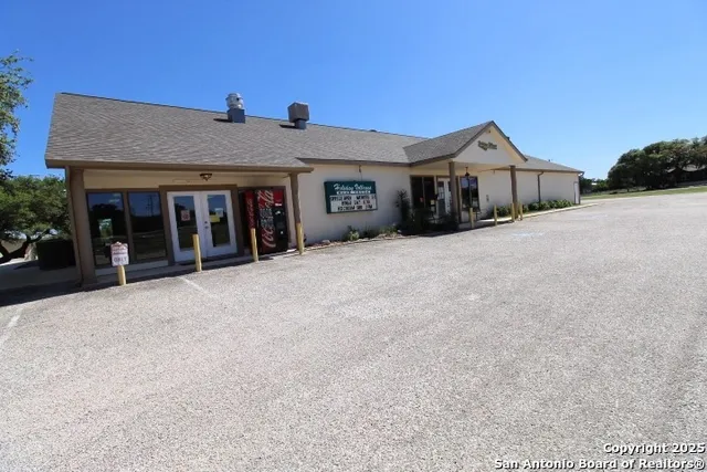 a view of a park with large trees