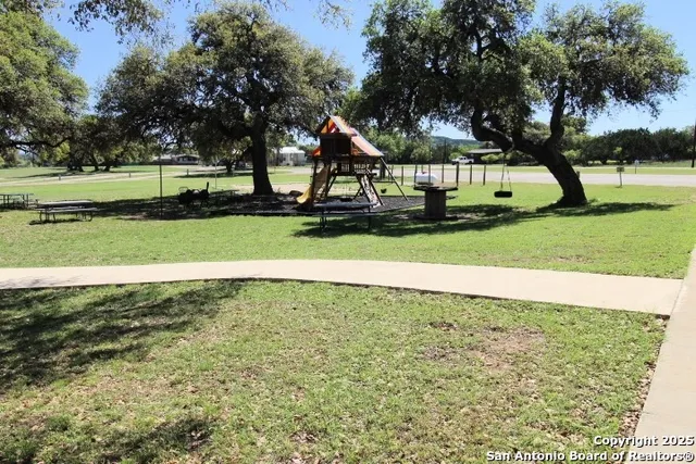 a view of backyard with green space