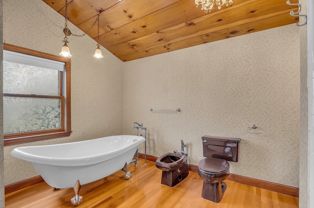 65 Bailey Road Andover, MA 01810 - Photo 30 of 42 a bathroom with a toilet sink and mirror