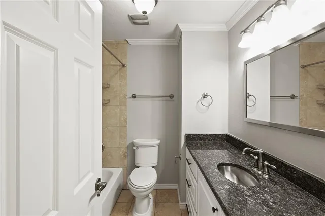a bathroom with a toilet and shower