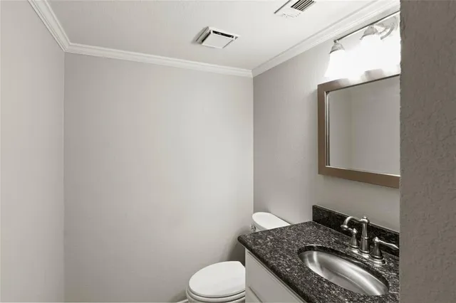 a view of a hallway with wooden floor and entryway