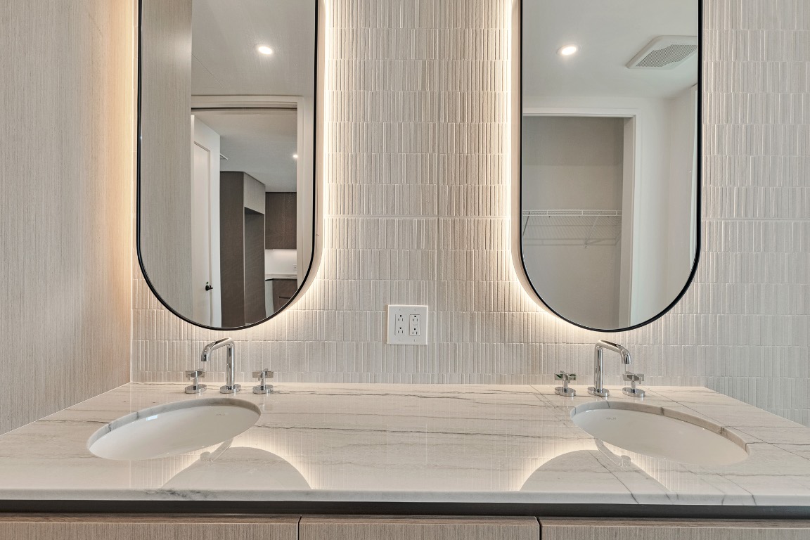 610 Davis Street, Unit 4406 Austin, TX 78701 - Photo 15 of 36 a bathroom with a sink and a mirror