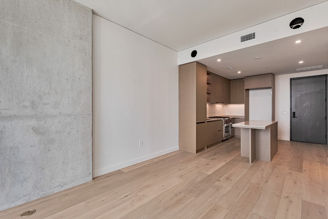 610 Davis Street, Unit 4406 Austin, TX 78701 - Photo 8 of 36 a view of a kitchen with wooden floor