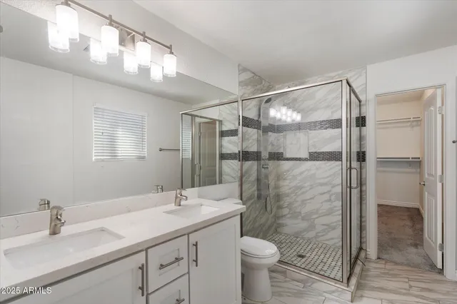 a bathroom with a shower and toilet