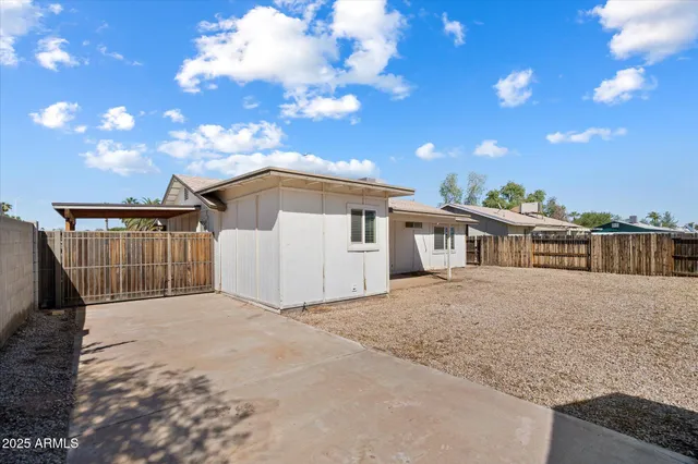a front view of a house with a yard and a garage