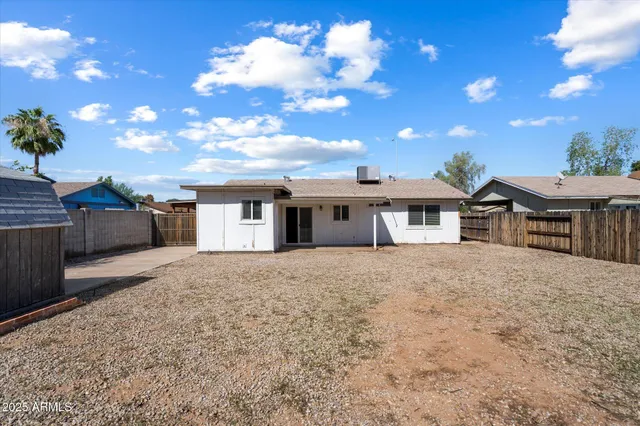 a view of backyard and entertaining space