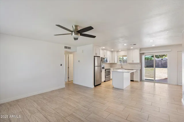 a view of a kitchen with a sink and microwave