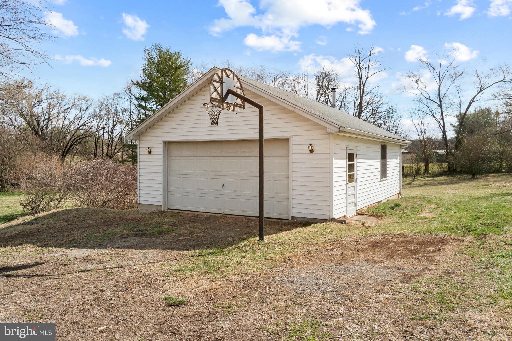 72 Shepherds Mill Road Berryville, VA 22611 - Photo 32 of 36 Oversized two car garage with wood stove