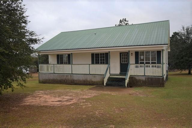 1508 McCauley Road Baker, FL 32531 - Photo 2 of 12 a front view of a house with a yard