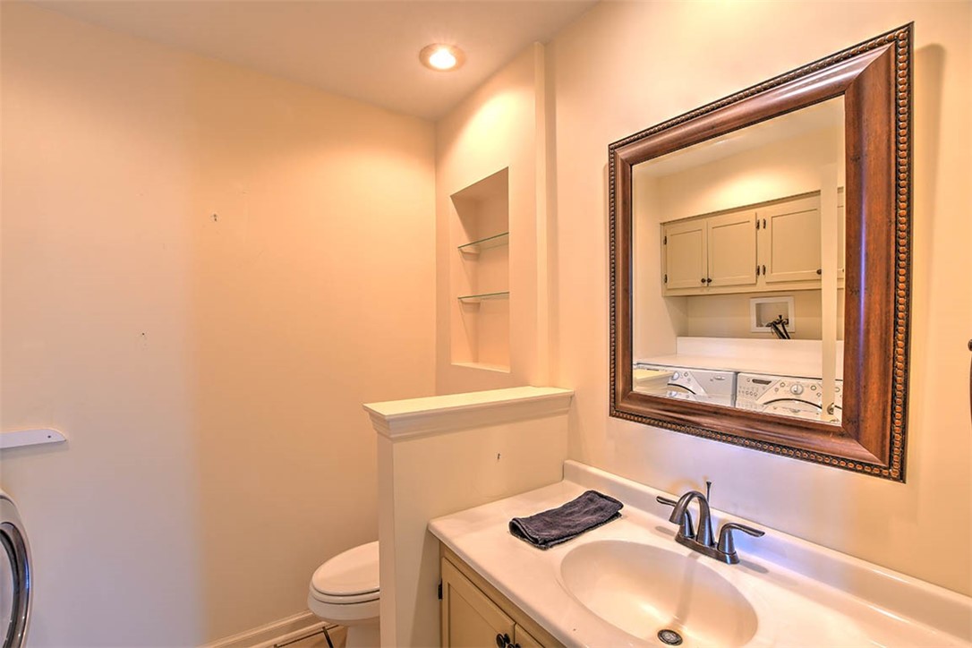 877 East 1800 North Road Assumption, IL 62510 - Photo 42 of 46 a bathroom with a sink vanity mirror and toilet